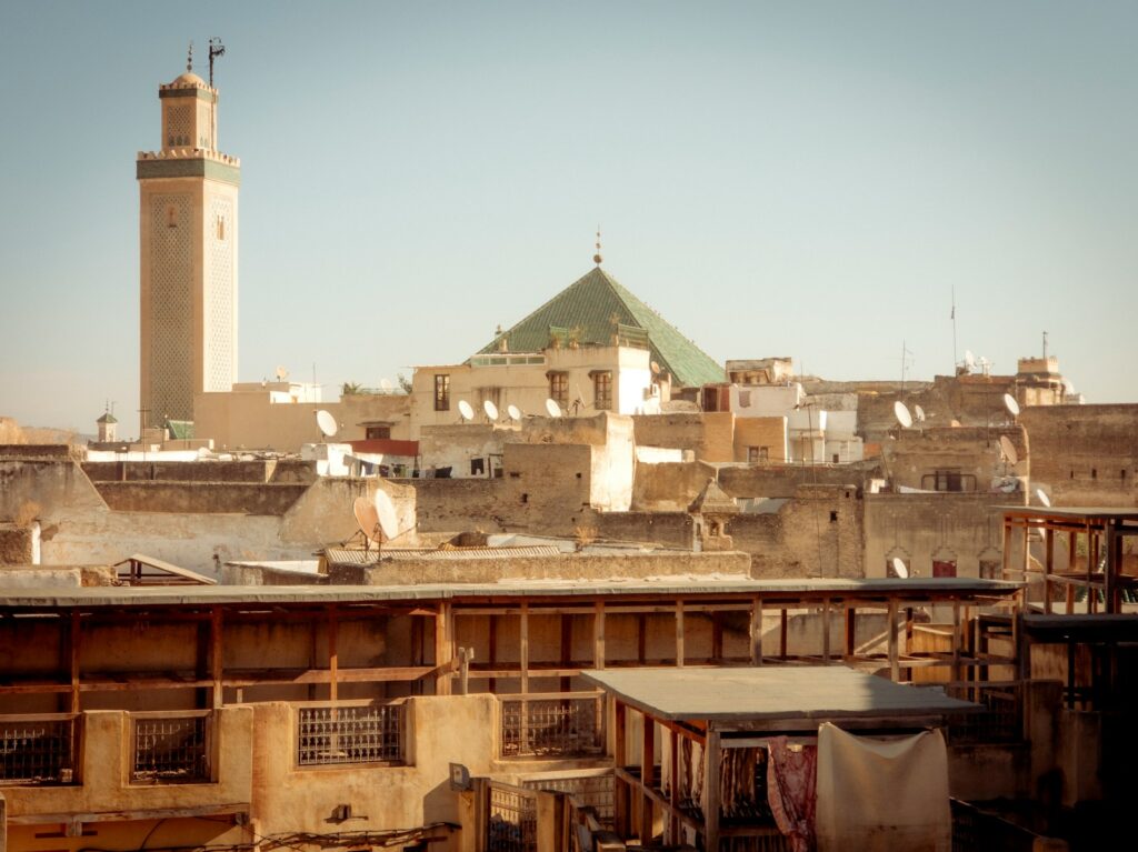 A view of a city from a rooftop of a building