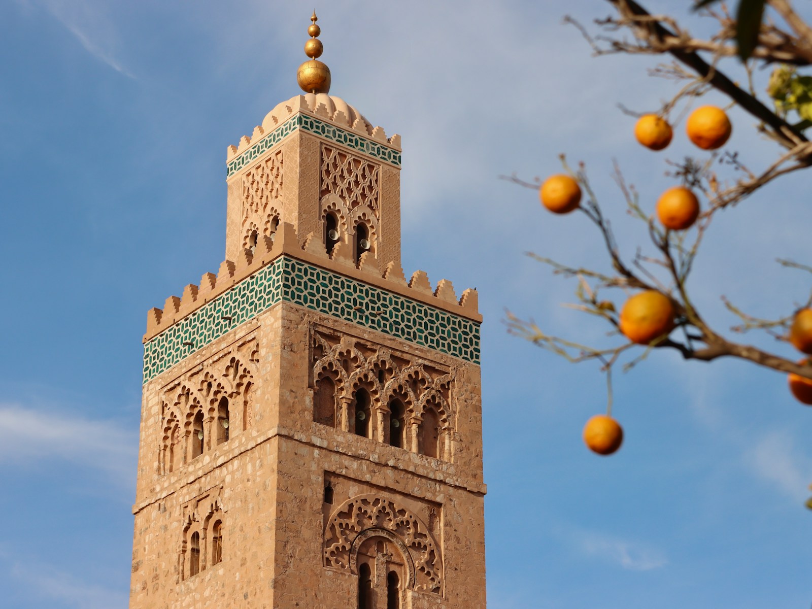 A tall tower with a clock on the top of it