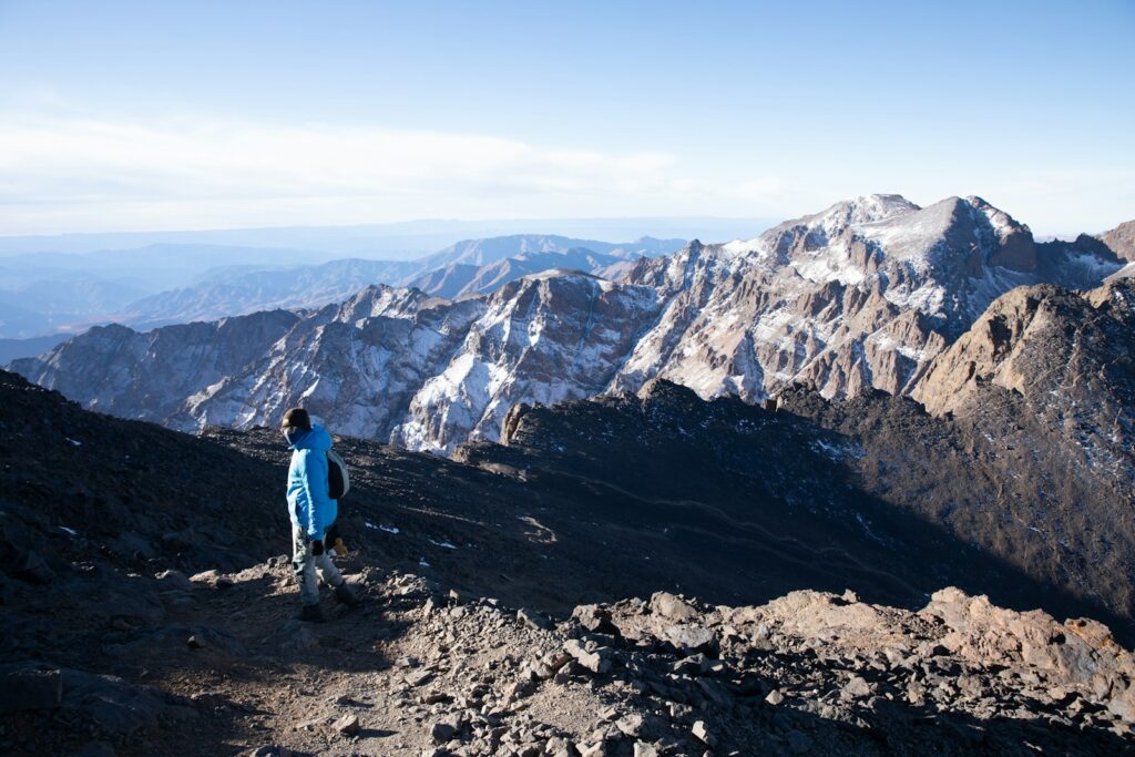 A person standing on top of a mountain
